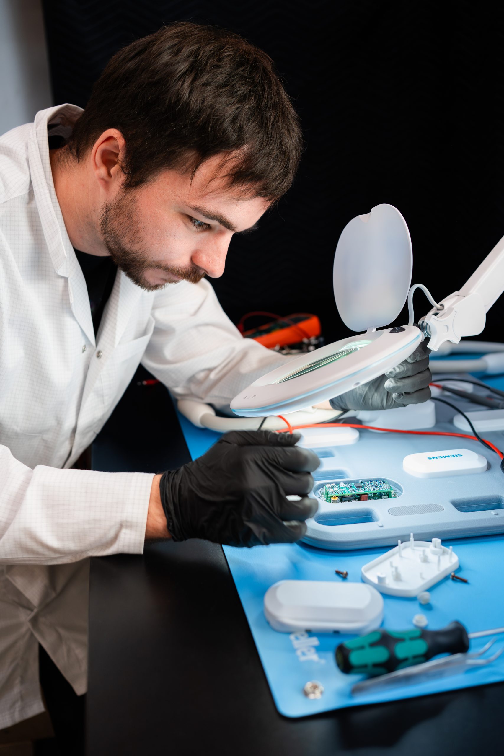 MRI coil specialist working on an MRI coil in our MRI Coil Repair Area - LBN Medical